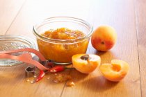 Apricots and ginger chutney with fresh chili in a mason jar — Stock Photo