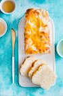 Onion and cheese bread loaf with slices — Stock Photo