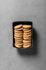 Spelt cookies with almonds in a box on a gray background — Stock Photo
