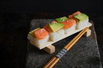 Sushi with salmon and avocado (Japan) — Stock Photo