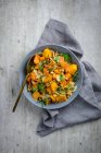 Pumpkin salad with walnuts, Parmesan and herbs — Stock Photo