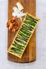 Sandwich with salmon and cheese on wooden board — Stock Photo