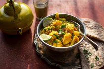 Indian cauliflower tumeric curry with chapati — Stock Photo