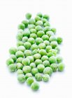 Green peas on white background — Stock Photo