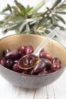 Black kalamata olives in small bowls — Stock Photo