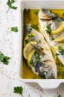 Bream from the oven baked in white wine, lemon and olive oil — Stock Photo