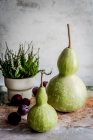 Still life with pears and grapes on a wooden background — Stock Photo
