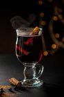 Glass of steming mulled wine with cinnamon — Stock Photo
