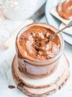 Jar full of homemade nutella, hazelnut chocolate spread (vegan, sugar-free) — Stock Photo