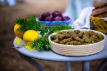 Easter table with dolmas, Easter eggs and freshly baked bread — Stock Photo