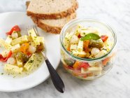Spicy pickled Emmental cheese in vinegar and oil, gherkins, pearl onions and peppers — Stock Photo