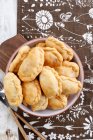 Bowl of fried dumplings with meat and potato — Stock Photo