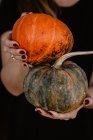 Woman holding a pumpkin in her hands — Stock Photo