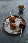 Close-up shot of delicious Ice lollies on crushed iceIce lollies on crushed ice — Stock Photo