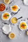 Mini pavlovas with lemon curd and blood orange — Stock Photo