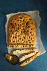 Homemeade olive oil and black olive foccacia with rosemary — Stock Photo