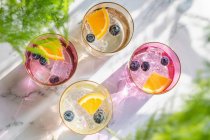 Flavored water with blueberries and orange slices — Stock Photo