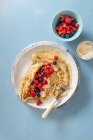Crepes with vanilla cream cheese and berries — Stock Photo