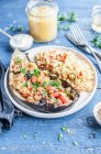 Vegeterian eggplant stuffed with bell pepper, tomatoes and parsley, served with bulgur — Stock Photo