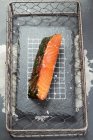 Smoked salmon in a grill basket — Foto stock