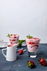 Strawberries mousse in glasses with jam and mint leaves — Stock Photo