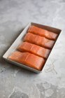 Raw salmon fillets in a tin bowl — Fotografia de Stock