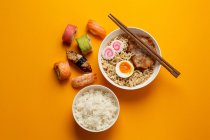 Traditional Japanese food, ramen soup, rice and sushi — Stock Photo
