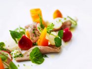 Beef tongue with baby vegetables, radishes and watercress — Stock Photo