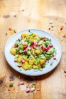 Potato salad with radishes, cucumbers and spring onions — Stock Photo