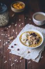 Pumpkin porridge with bananas, dried cranberries and walnuts — Stock Photo