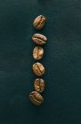 A row of coffee beans — Stock Photo