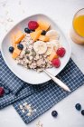 Vegan porridge with fresh fruits and orange juice — Stock Photo