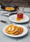 Apple pancakes with maple syrup — Stock Photo