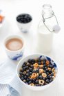 Bowl of cereal loops with a good amount of blueberries — Stock Photo