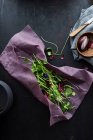 Fresh wild herbs in beeswax paper wrap — Stock Photo