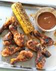 Grilled chicken legs with corn cob and barbecue sauce — Foto stock
