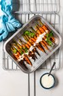 Grilled chicken wings with vegetables and spices — Stock Photo
