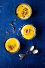 Rice pudding with mango sauce and cardamom — Stock Photo