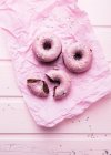 Vegan chocolate donuts with icing and sugar decorations — Stock Photo