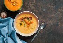 Orange melon cold soup, with jamon, typical Spanish dish — Stock Photo