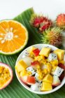 Exotic fruit salad with dragon fruit, mango and passion fruit — Stock Photo