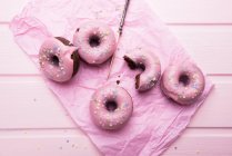 Vegan chocolate donuts with icing and sugar decorations — Stock Photo