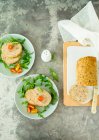 Baked turkey meatloaf with mortadella and aromatic herbs served with rocket and tomatoes — Stock Photo