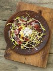 Dandelion salad with Iberico ham and a poached egg — Stock Photo