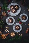 Chocolate Elisenlebkuchen (Nuremberg gingerbread cake) on metal plates — Stock Photo