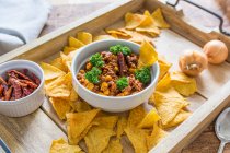 Chilli con carne with nachos — Stock Photo