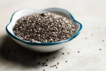 Chia seeds in a bowl on a white background — Stock Photo