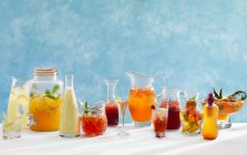 Summer cocktails with fruits and berries on table — Stock Photo