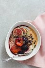 Buckwheat Porridge With Plums and figs in bowl — Stock Photo