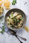 Tagliatelle in cashew nuts cream with grilled green asparagus and smoked tofu — Stock Photo